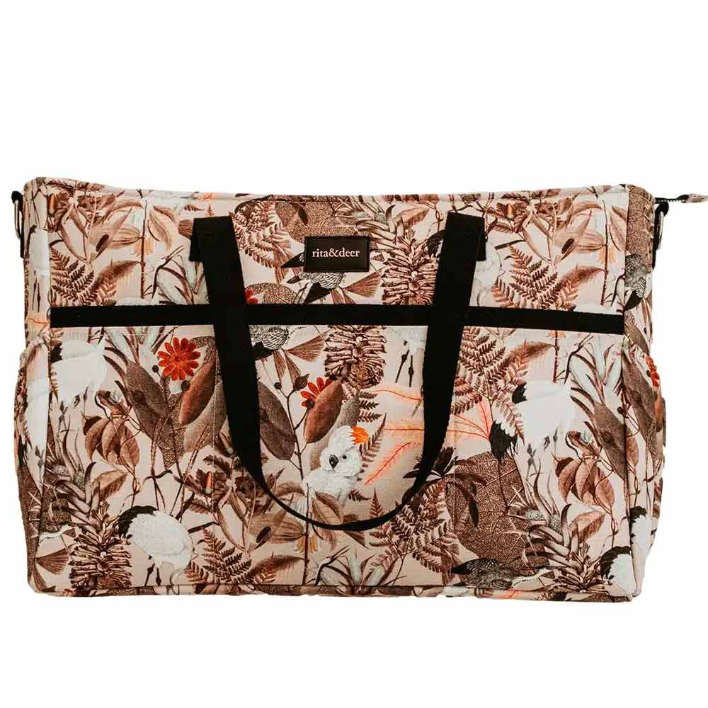 bolso para carro gemelar de bebé de color rosa palo y estampado de cactúas en diferentes tonos tierra
