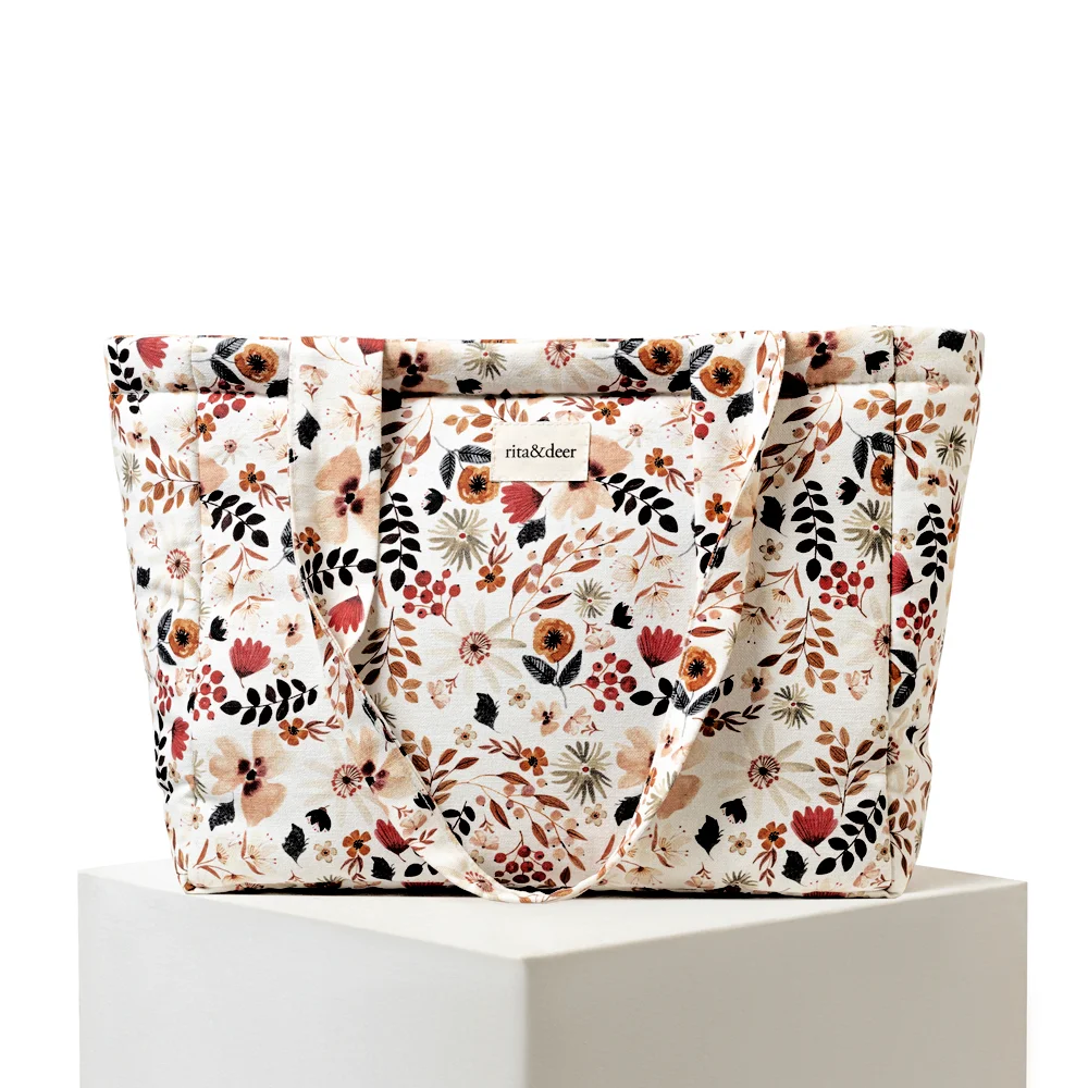 bolso carro de bebé panera mum de la colección minimum de rita&deer con estampado floral o de flores