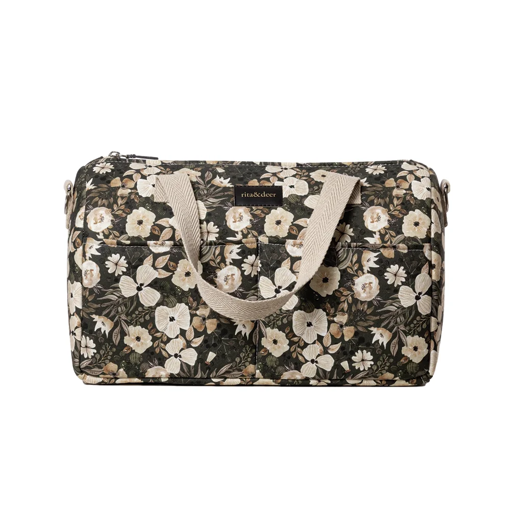 bolso de carro de bebé de color verde oscuro con flores en tono beige green forest