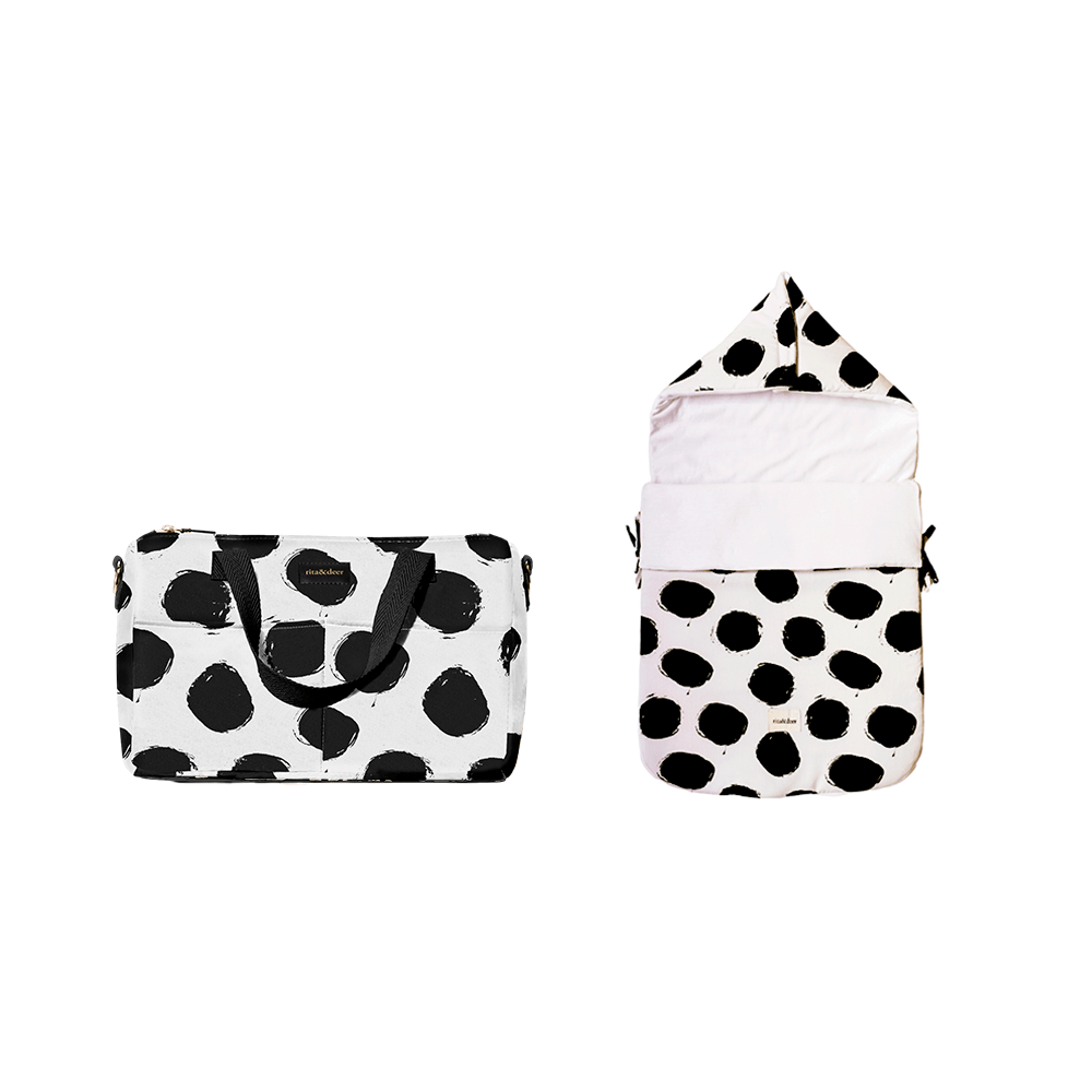 bolso carro bebé chester bubble dots con saco de capazo estampado de lunares en color negro a conjunto