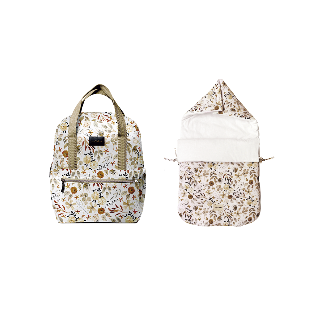 El pack mochila para carrito de bebé Bloom con saco capazo de Rita & Deer combina diseño y funcionalidad con características clave como el tejido antimanchas e impermeable. Este conjunto es ideal para padres que buscan soluciones prácticas y elegantes para el paseo del bebé. Este conjunto esencial combina una práctica mochila para tu carrito y un acogedor saco capazo, ambos confeccionados con tejido de algodón 100% orgánico OEKO-TEX que es a la vez lleva un acabado antimanchas e impermeable.